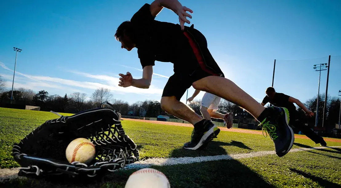 Baseball-players-sprinting-on-a-baseball-field-for-their-spring-strength-training-routine.jpg